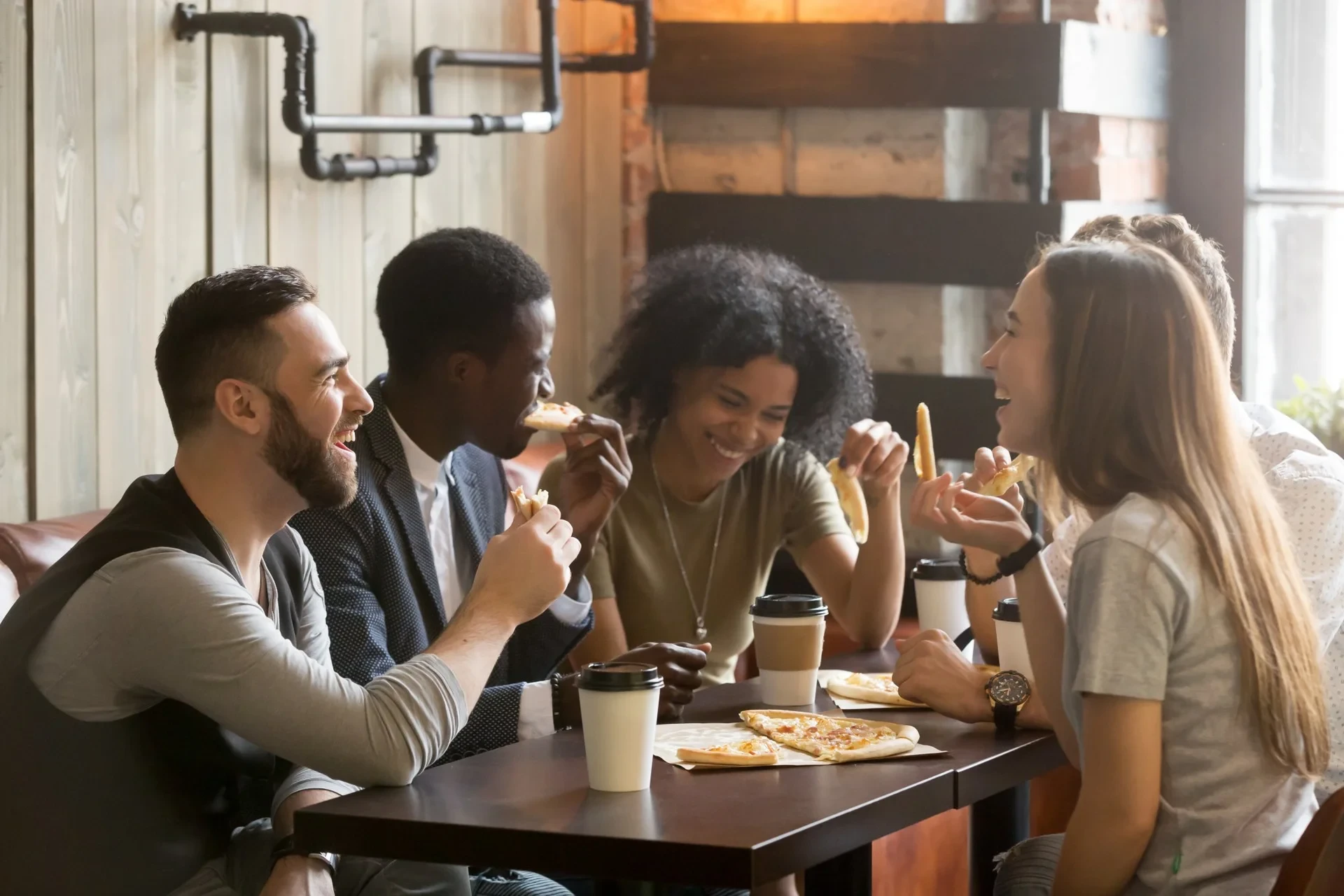 Diverse neighbors sharing a meal together — the heart of intentional community at Porchaven™
