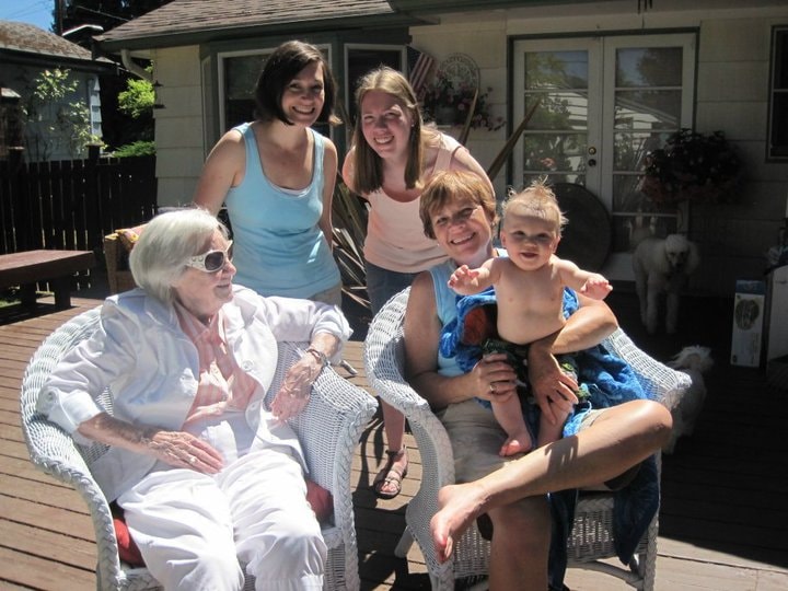 Four generations of family gathered together on a sunny porch — the multigenerational spirit of Porchaven™